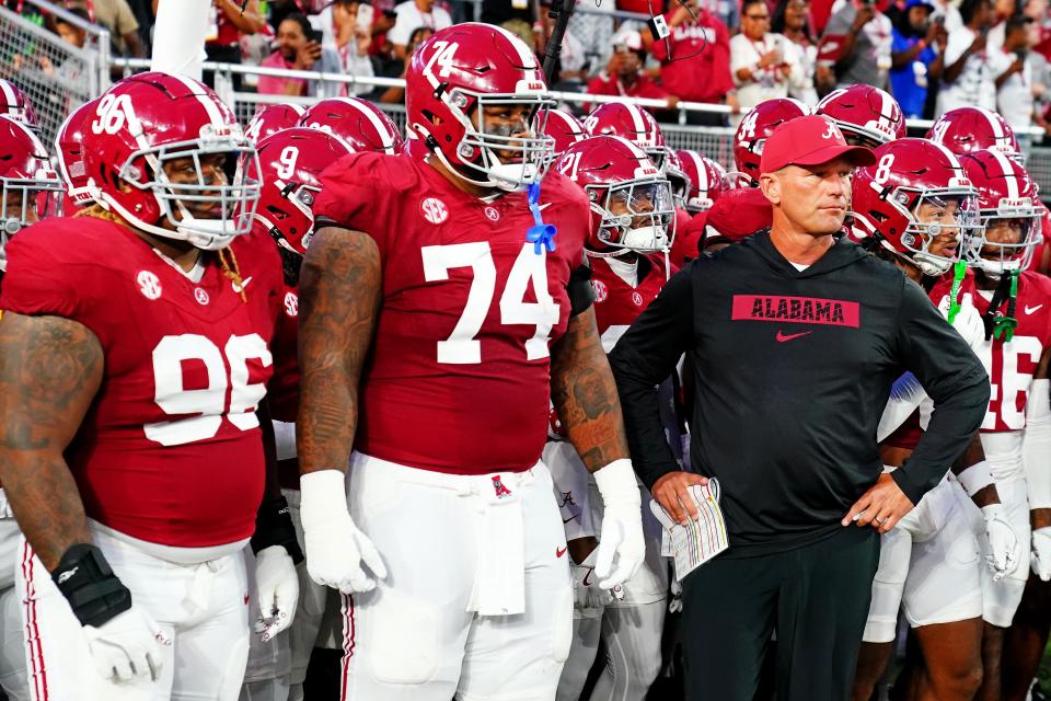 Sep 28, 2024; Tuscaloosa, Alabama, USA; Alabama Crimson Tide head coach Kalen DeBoer leads his team onto the field before the game against the Georgia Bulldogs at Bryant-Denny Stadium. Mandatory Credit: John David Mercer-Imagn Images