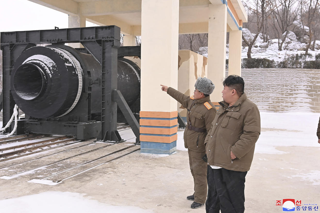 In this photo provided by the North Korean government, North Korean leader Kim Jong Un, right, supervise what it says a test of "high-thrust solid-fuel motor" at the Sohae Satellite Launching Ground in North Korea Thursday, Dec. 15, 2022. Independent journalists were not given access to cover the event depicted in this image distributed by the North Korean government. The content of this image is as provided and cannot be independently verified. Korean language watermark on image as provided by source reads: "KCNA" which is the abbreviation for Korean Central News Agency. (Korean Central News Agency/Korea News Service via AP)