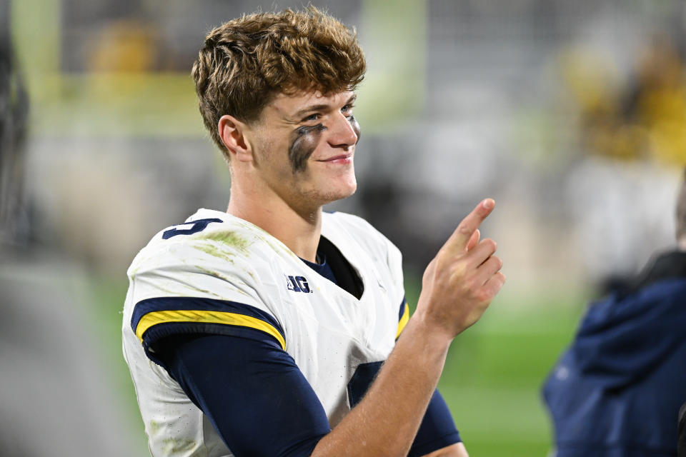 EAST LANSING, MI - OCTOBER 21: Michigan Wolverines quarterback J.J. McCarthy (9) reacts to a comment from the crowd during a college football game between the Michigan State Spartans and Michigan Wolverines on October 21, 2023 at Spartan Stadium in East Lansing, MI. (Photo by Adam Ruff/Icon Sportswire via Getty Images)