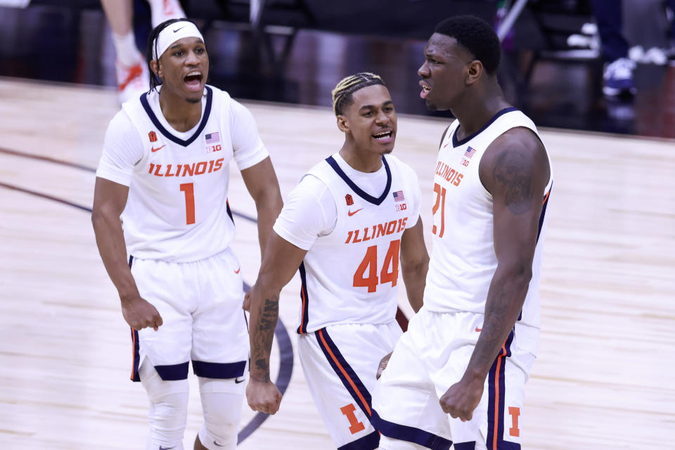 Illinois star Kofi Cockburn celebrates with his teammates after a dunk against Rutgers on March 12. (Justin Casterline/Getty Images)