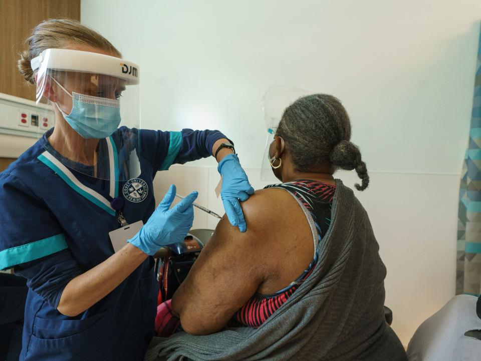 Los Angeles health workers administer COVID-19 vaccinations on Feb. 24.