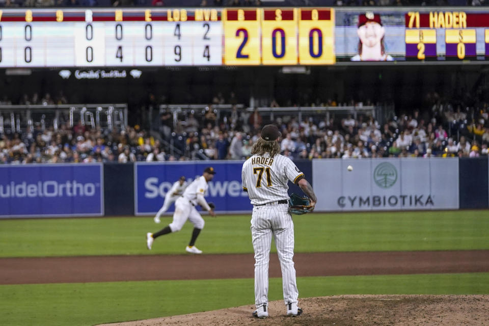 San Diego Padres relief pitcher Josh Hader (71) turns around to watch the ball clear the infield after Colorado Rockies' Brendan Rodgers hit a single during the ninth inning of a baseball game Tuesday, Sept. 19, 2023, in San Diego. (AP Photo/Gregory Bull)