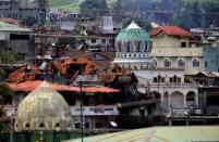 Damaged buildings and houses are seen as government forces continue their assault against insurgents from the Maute group, who have taken over large parts of the Marawi City, Philippines June 22, 2017. REUTERS/Romeo Ranoco
