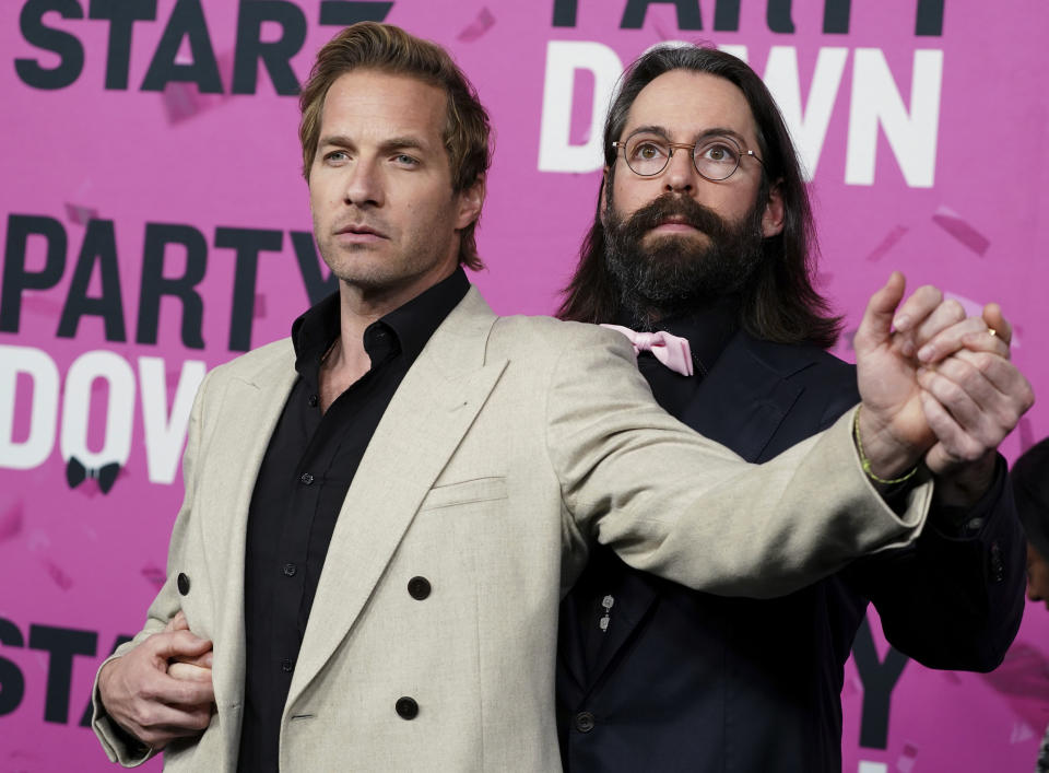 Ryan Hansen, left, and Martin Starr arrive at the premiere of "Party Down" on Wednesday, Feb. 22, 2023, at Regency Bruin Theatre in Los Angeles. (Photo by Jordan Strauss/Invision/AP)