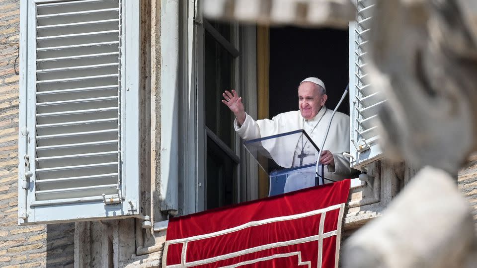 Pope Francis waves from a window of the apostolic palace overlooking St. Peter's Square in the Vatican during the weekly Angelus prayer followed by the recitation of the Regina Coeli on May 09, 2021. - Vincenzo Pinto/AFP/Getty Images