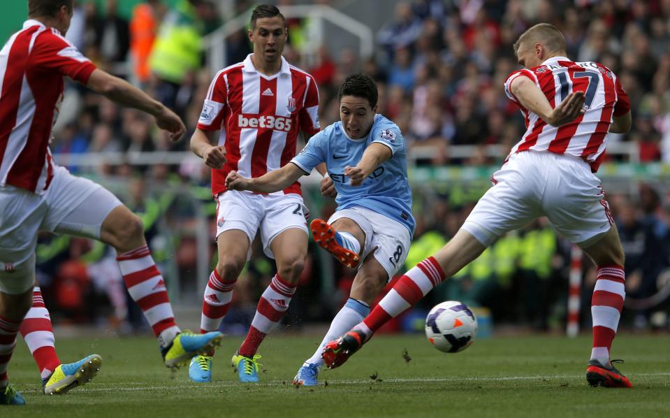 Manchester City's Samir Nasri shoots for the goal during their English Premier League soccer match against Stoke City at the Britannia Stadium in Stoke-on-Trent September 14, 2013.