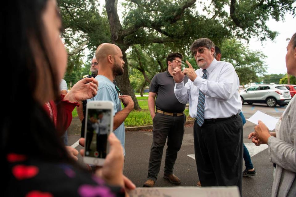 Rev. Blair Bradley, pastor for the Covenant of Peace Church in Harrison County, argues with protestors who are against removing library books outside the West Biloxi library in Biloxi where a library board meeting was being held on Monday, July 25, 2022. Bradley was one of two people who spoke to Biloxi City Council and asked them to consider removing children’s books that are inclusive of LGBTQ+ people.