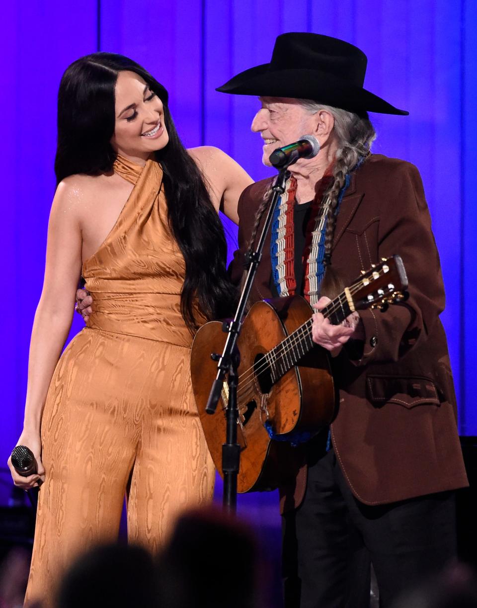 Kacey Musgraves and Willie Nelson perform at the 53rd annual CMA Awards at Bridgestone Arena on Wednesday, Nov. 13, 2019.