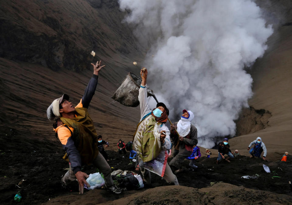 Villagers standing on the slopes near the crater of Mount Bromo