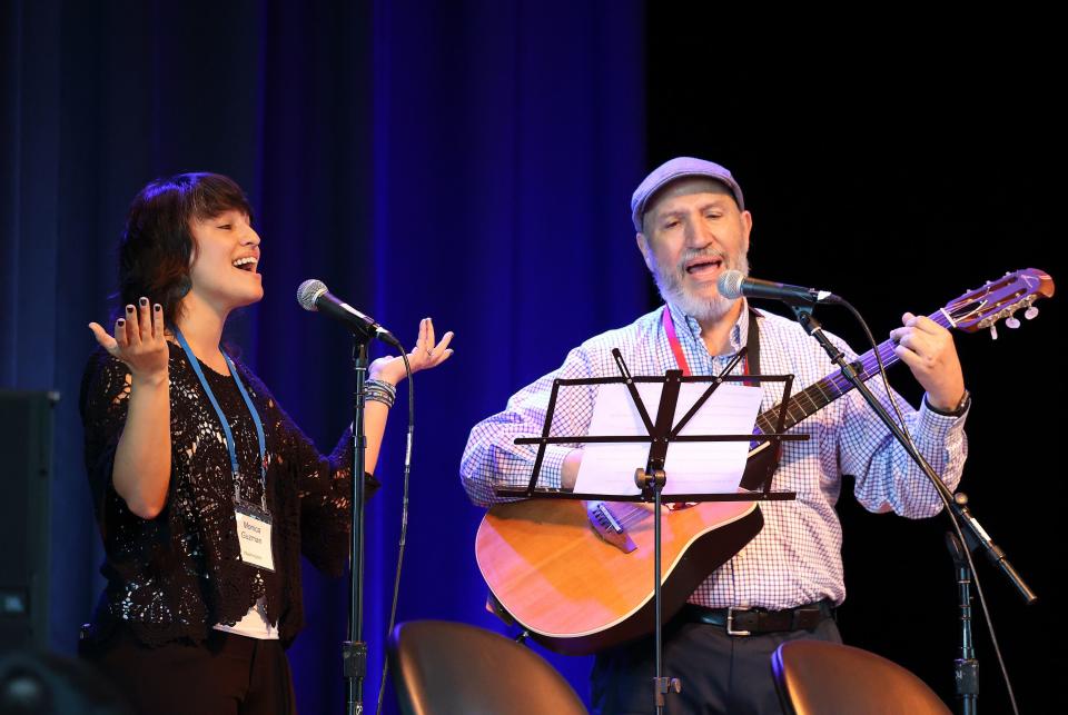 Monica Guzman and Bernardo Guzman sing a song after Guzman’s keynote speech at the Braver Angels National Convention at Gettysburg College in Gettysburg, Pa., on Thursday, July 6, 2023. | Kristin Murphy, Deseret News