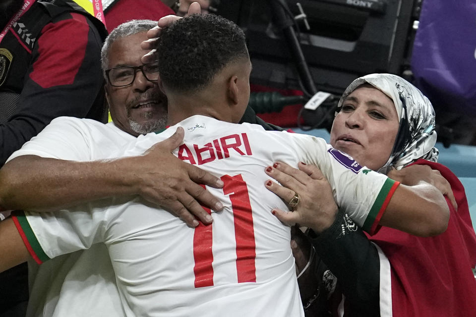 Morocco's Abdelhamid Sabiri celebrates with supporters after the World Cup group F soccer match between Belgium and Morocco, at the Al Thumama Stadium in Doha, Qatar, Sunday, Nov. 27, 2022. (AP Photo/Christophe Ena)