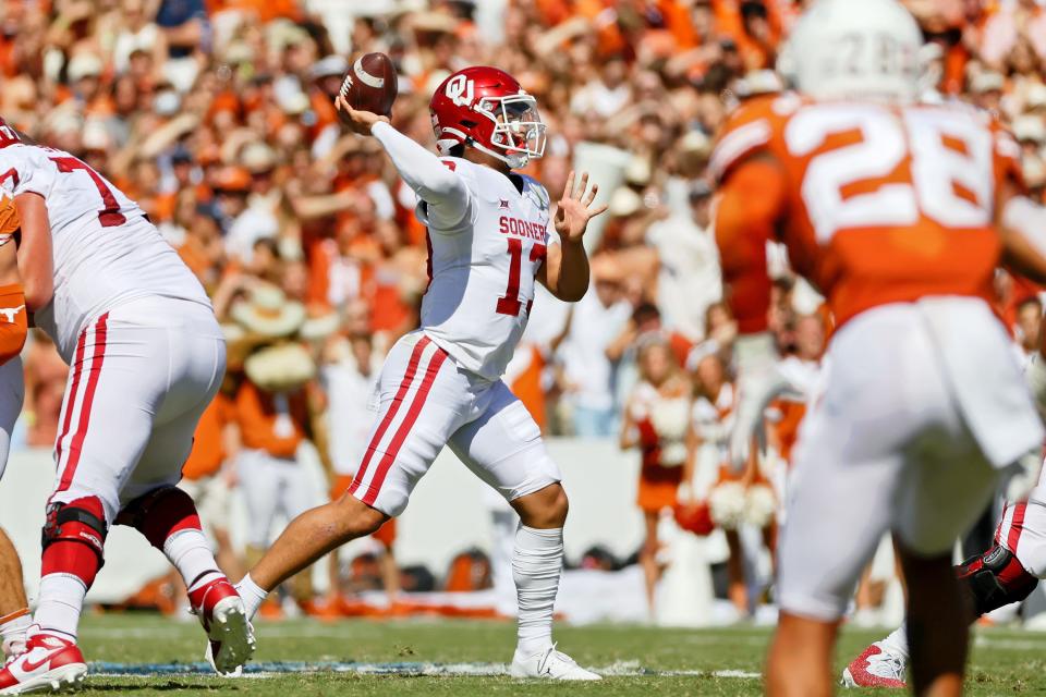 Oklahoma Sooners quarterback Caleb Williams (13) passes the ball against the Texas Longhorns during the second quarter at the Cotton Bowl.