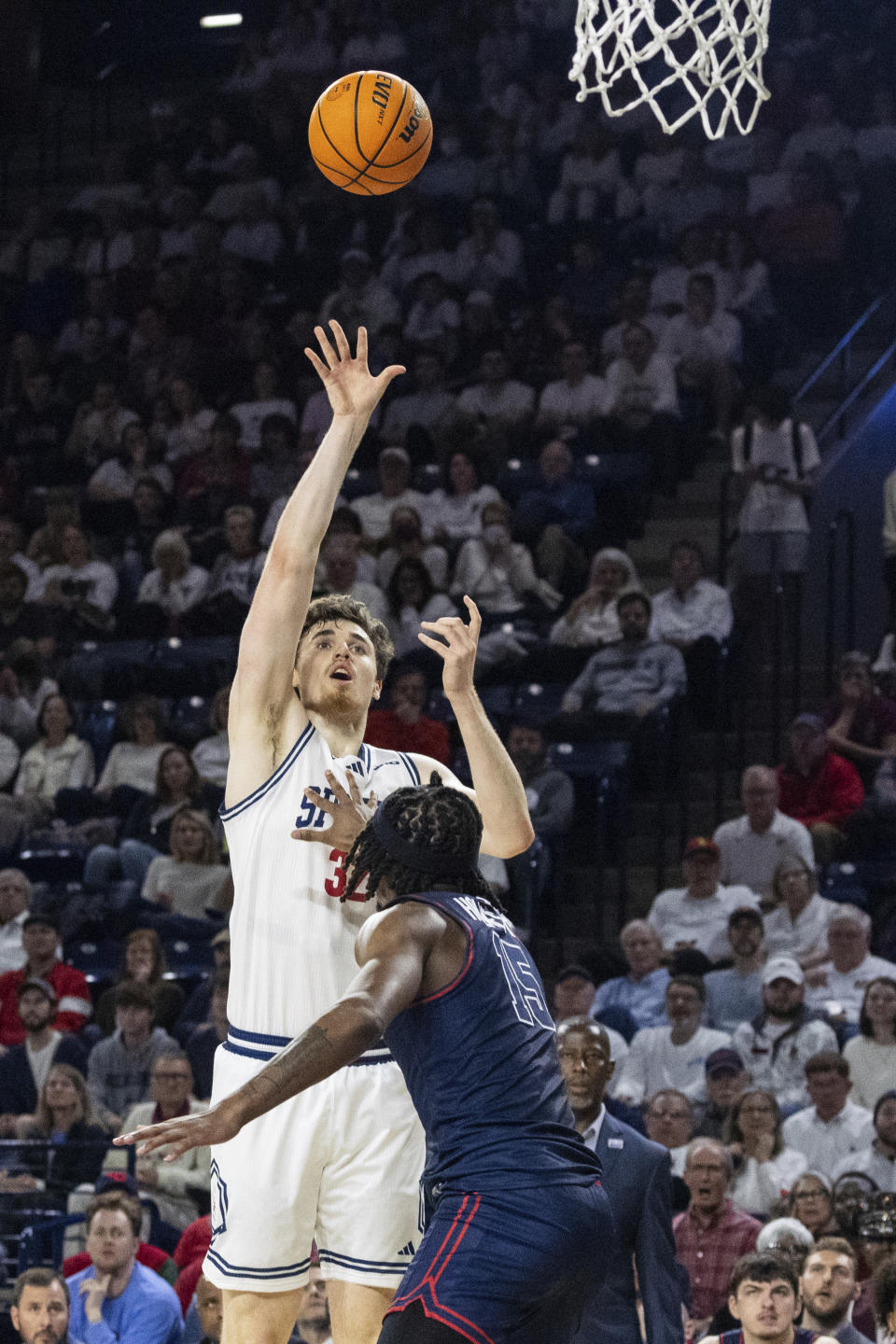 Richmond center Neal Quinn (32) shoots over Dayton forward DaRon Holmes II (15) during the first half of an NCAA college basketball game on Saturday, Jan. 27, 2024 in Richmond, Va. (AP Photo/Shaban Athuman)