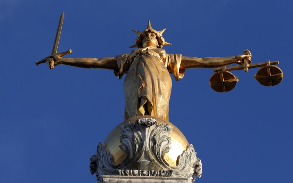  Statue of Lady Justice  -  Jonathan Brady/ PA