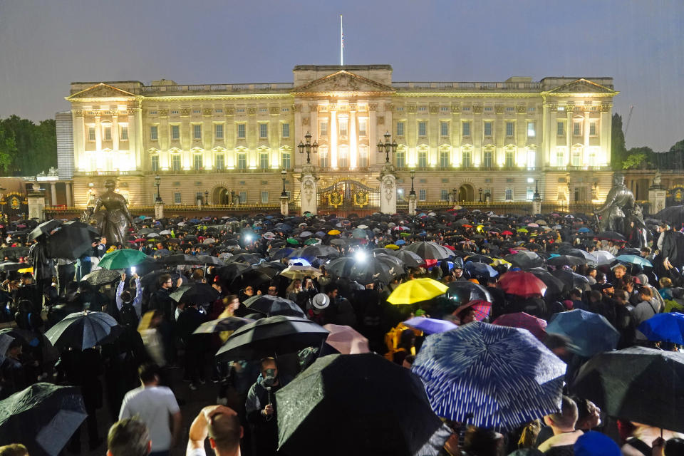 <p>People gather outside the gates of the Buckingham Palace in London, following the death of Queen Elizabeth II. Picture date: Thursday September 8, 2022. (Photo by Victoria Jones/PA Images via Getty Images)</p> 