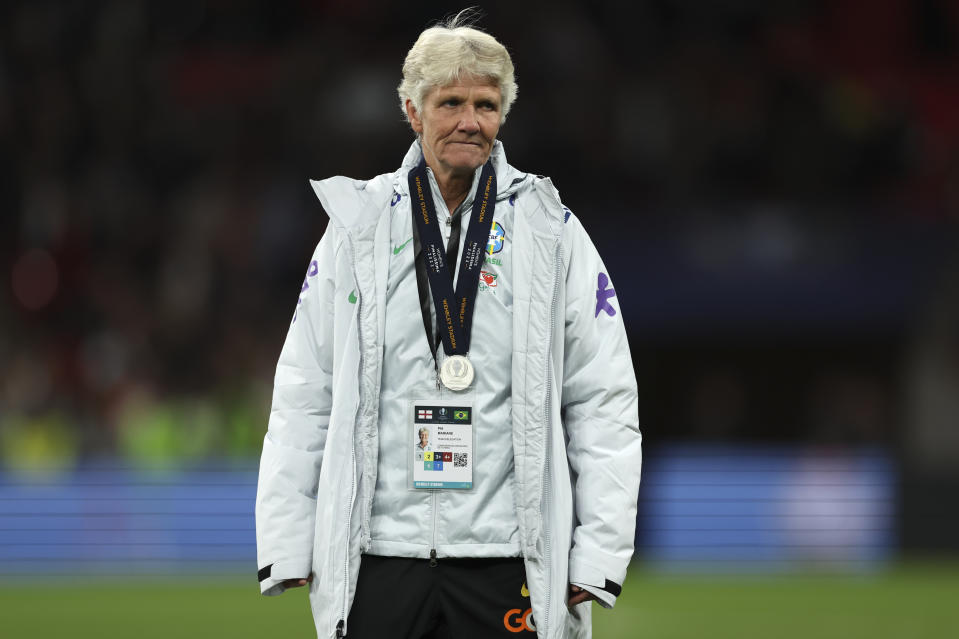 Brazil's manager Pia Sundhage stands on the pitch with her runners-up medal at the end of the Women's Finalissima soccer match between England and Brazil at Wembley stadium in London, Thursday, April 6, 2023. (AP Photo/Ian Walton)