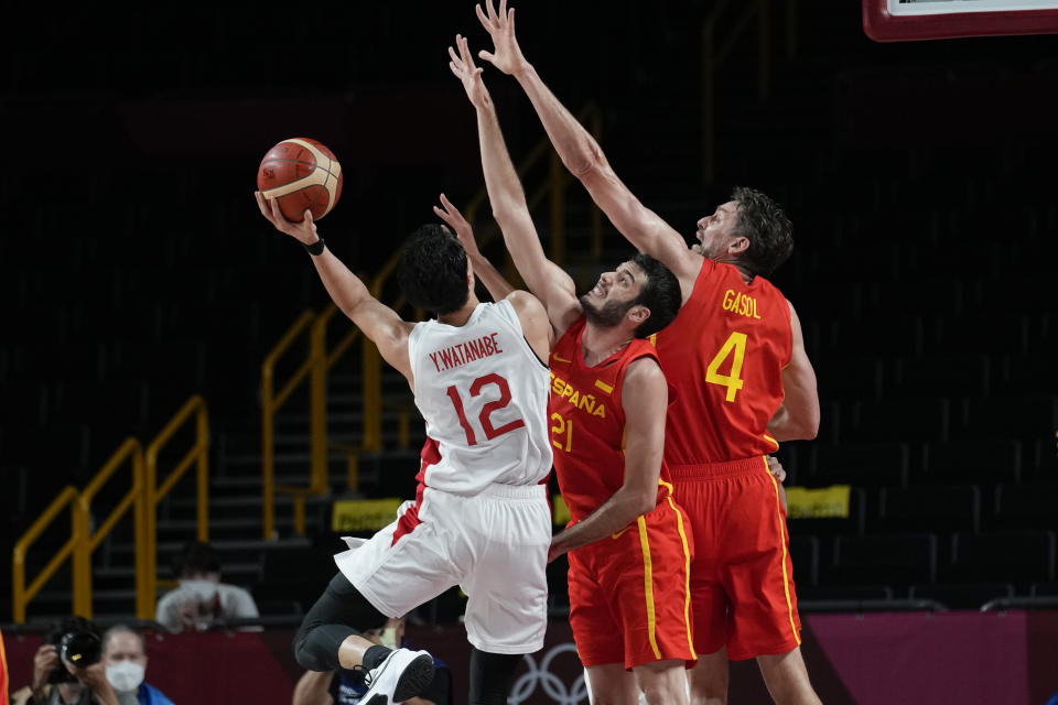 Japan's Yuta Watanabe (12) shoots on Spain's Alejandro Abrines Redondo (21) and Pau Gasol (4) during a men's basketball preliminary round game at the 2020 Summer Olympics in Saitama, Japan, Monday, July 26, 2021. (AP Photo/Eric Gay)