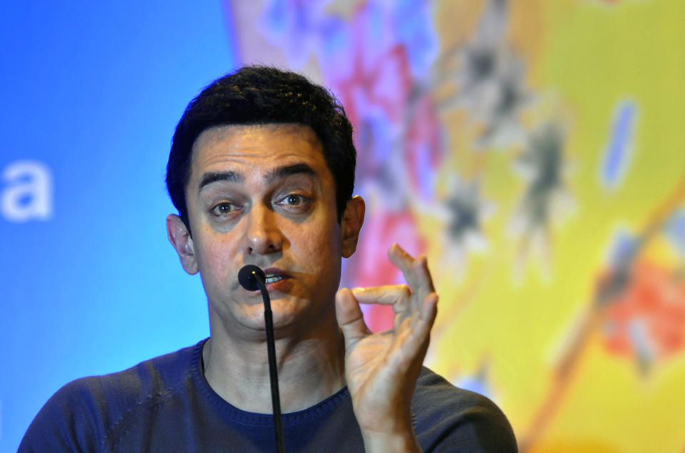 FILE- In this Nov. 30, 2011 file photo, Indian Bollywood actor Aamir Khan speaks during an event where he was appointed as the UNICEF ambassador promoting nutrition for children, in New Delhi, India. Bollywood megastar Khan is making India confront its dark side. Shining light on inequities like the rampant abortion of female fetuses, caste discrimination and the slaying of brides in dowry disputes, actor Khan has reached an estimated one-third of the country with a new TV talk show "Satyamev Jayate", or "Truth Alone Prevails," that tackles persistent flaws of modern India that most of its citizens would prefer to ignore.(AP Photo/Tsering Topgyal, file)