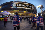 FILE - In this Jan. 7, 2018, file photo, New York Rangers fans arrive at T-Mobile Arena for an NHL hockey game between the Rangers and the Vegas Golden Knights in Las Vegas. T-Mobile Arena is one of the possible locations the NHL has zeroed in on to host playoff games if it can return amid the coronavirus pandemic. The league will ultimately decide on two or three locations for games, with government regulations, testing and COVID-19 frequency among the factors for the decision that should be coming within the next three to four weeks. (AP Photo/L.E. Baskow, File)