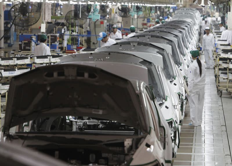 Thai workers work at a sedan line production at Honda Automobile in Rojana Industrial Park, Ayutthaya province