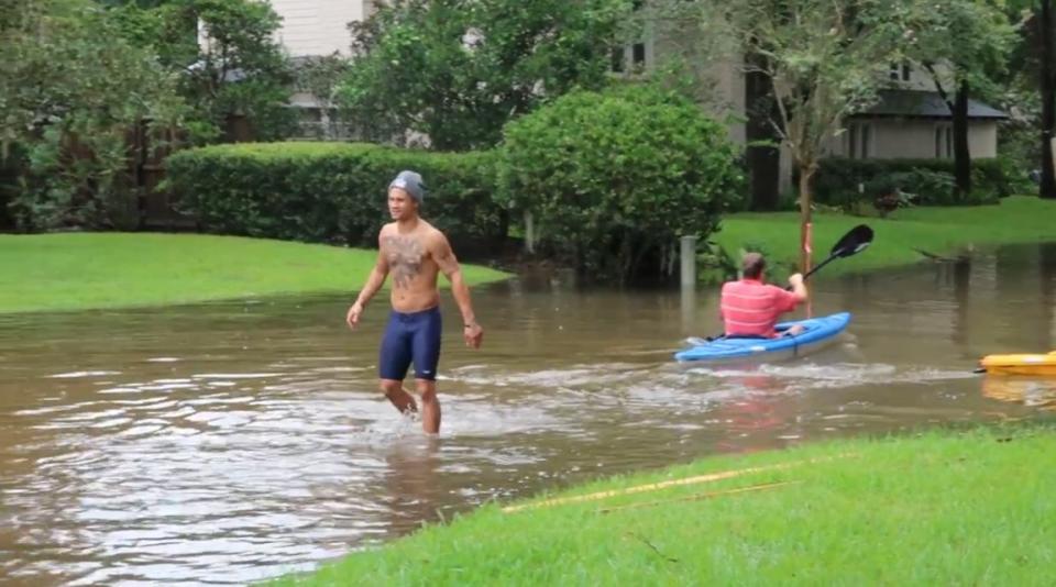 Regis Prograis (L) is shown in the aftermath of Hurricane Harvey. (Courtesy of Regis Prograis)