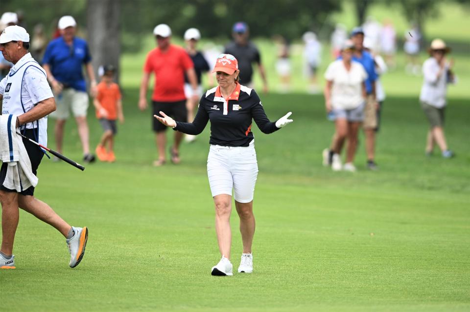 Senior LPGA golfer Annika Sörenstam puts up her hands after scoring an eagle on the second hole of the Senior LPGA Championship Tournament on Sunday at the Salina Country Club.