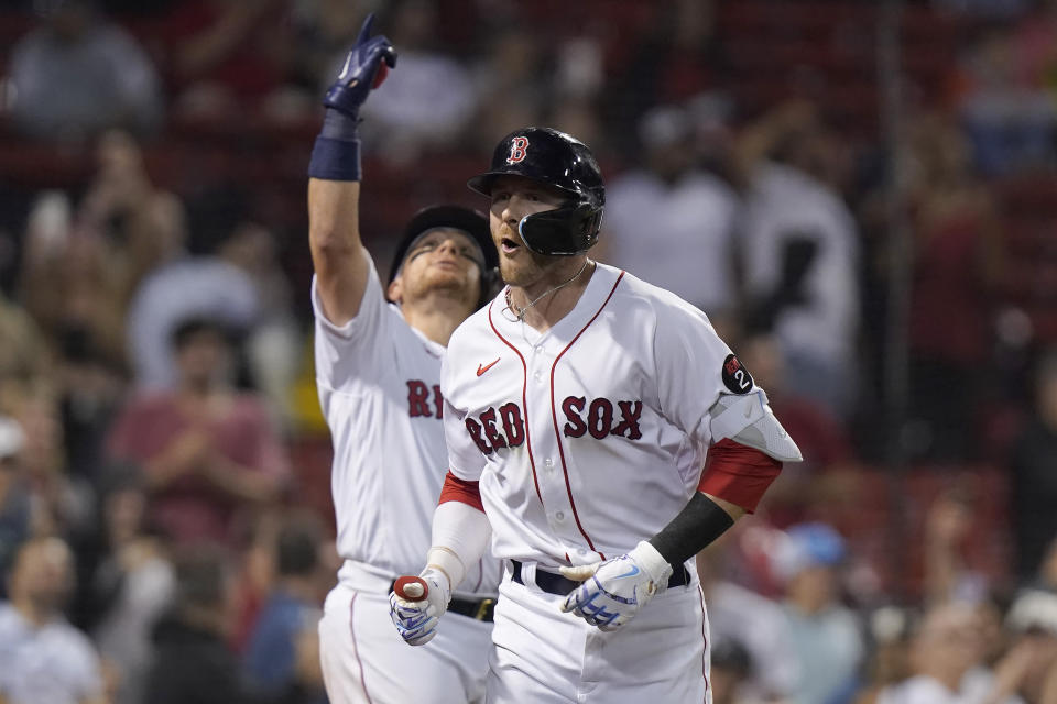 Boston Red Sox's Trevor Story, right, celebrates his home run with Christian Vazquez, left, in the seventh inning of a baseball game against the Houston Astros, Monday, May 16, 2022, in Boston. The Red Sox won 6-3. (AP Photo/Steven Senne)