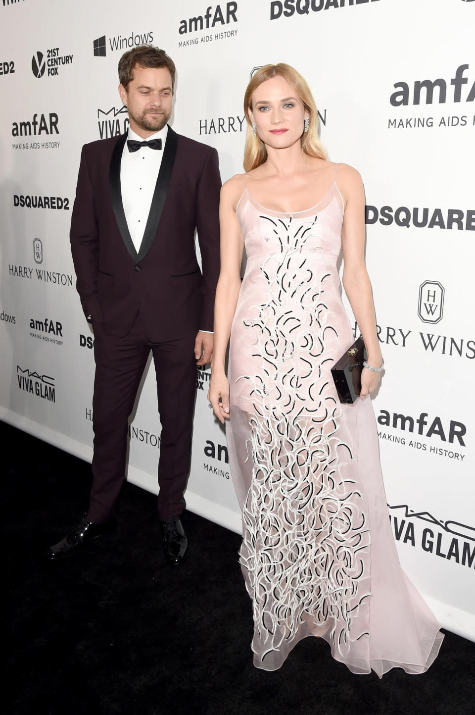 Diane Kruger in Carolina Herrera with her partner, Joshua Jackson, admiring the view on the red carpet at amfAR’s Inspiration Gala Los Angeles. 