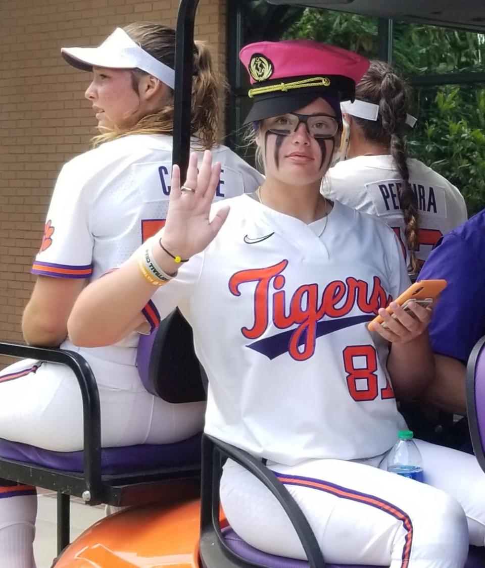 Clemson pitcher Millie Thompson sails off from the postgame news conference Sunday while wearing her captain's hat.