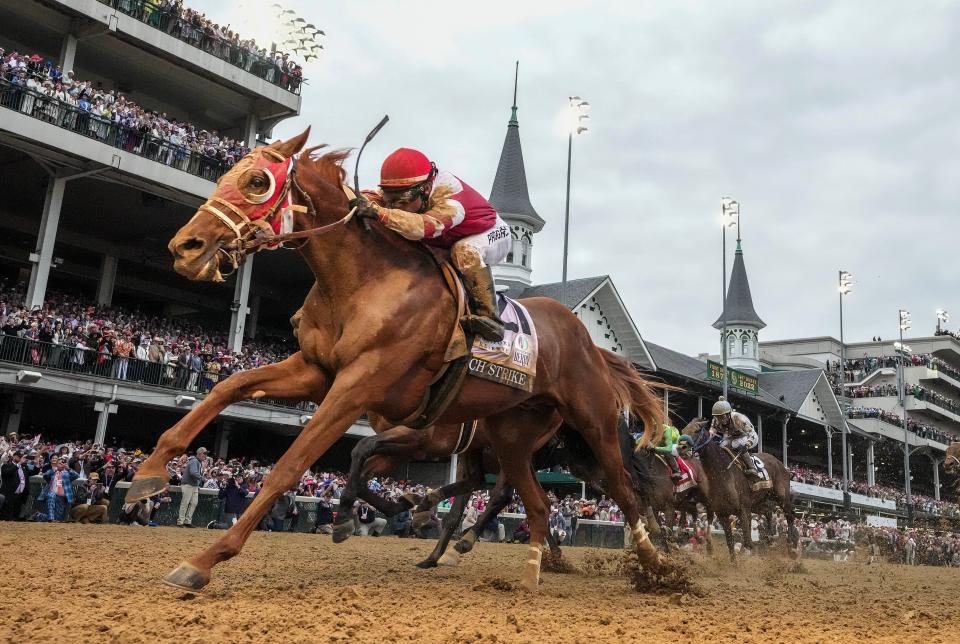Rich Strike, with Sonny Leon aboard, wins the 148th running of the Kentucky Derby in 2022.