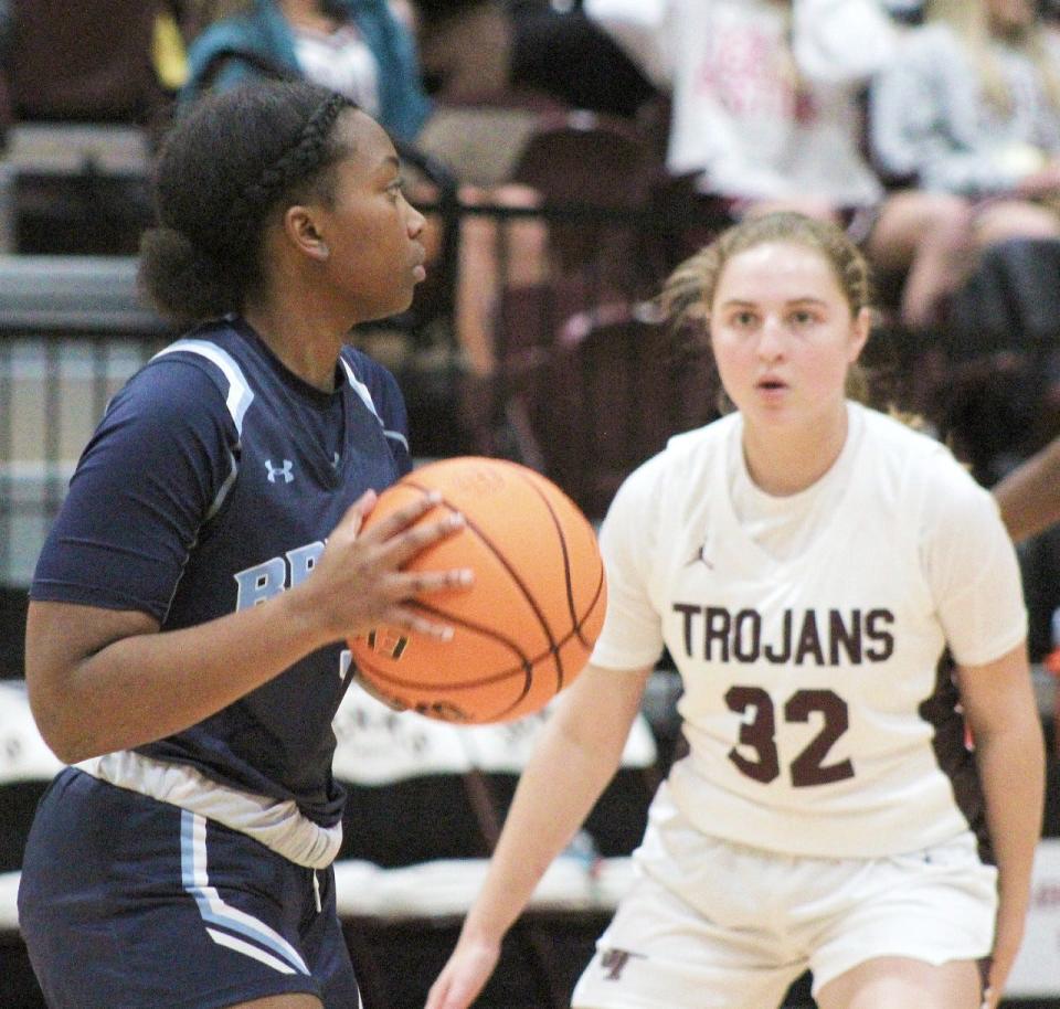 T'Keitha Valentine, left, of Bartlesville High looks to make a play against Jenks.