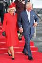 <p>The Duchess of Cornwall matched the decor, wearing a red long-sleeved dress and hat in Wales. She accompanied Prince Charles and Queen Elizabeth to the <a href="https://twitter.com/ClarenceHouse/status/1448631216962473991" rel="nofollow noopener" target="_blank" data-ylk="slk:opening of the Senedd;elm:context_link;itc:0;sec:content-canvas" class="link ">opening of the Senedd</a> (the Welsh Parliament), where they were greeted by a 21-gun salute. </p>