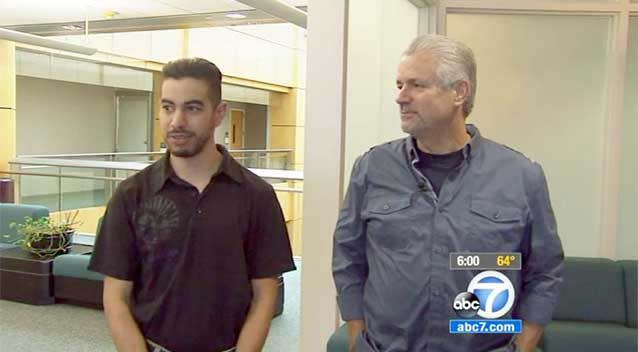 Retired California police officer Michael Buelna, right, joins Robin Barton, now 25, as they are reunited in Santa Ana for the first time since Buelna found Barton as a newborn abandoned in a garbage dumpster. Photo: KABC-TV via AP