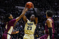 Purdue guard Jaden Ivey (23) cuts between Florida State guards Caleb Mills (4) and Jalen Warley (1) during the second half of an NCAA college basketball game in West Lafayette, Ind., Tuesday, Nov. 30, 2021. Purdue defeated Florida State 93-65. (AP Photo/Michael Conroy)