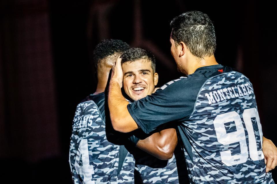 Florida's Victor Parreiras celebrates one of his four goals, a career high, with teammates Kiel Williams (left) and Lucas Montelares during a Major Arena Soccer League game Sunday in Lakeland.