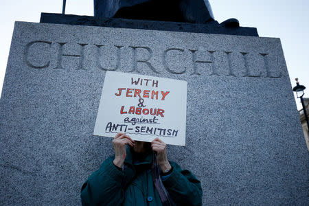 Supporters of Britain's opposition Labour Party attend a demonstration organised by the British Board of Jewish Deputies for those who oppose anti-Semitism, in Parliament Square in London, Britain, March 26, 2018. REUTERS/Henry Nicholls