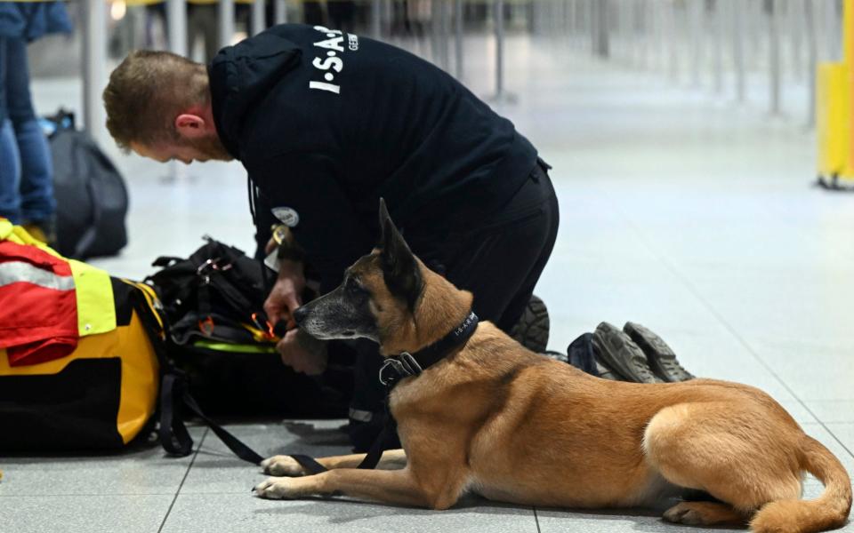 German search crews with their dogs - AP