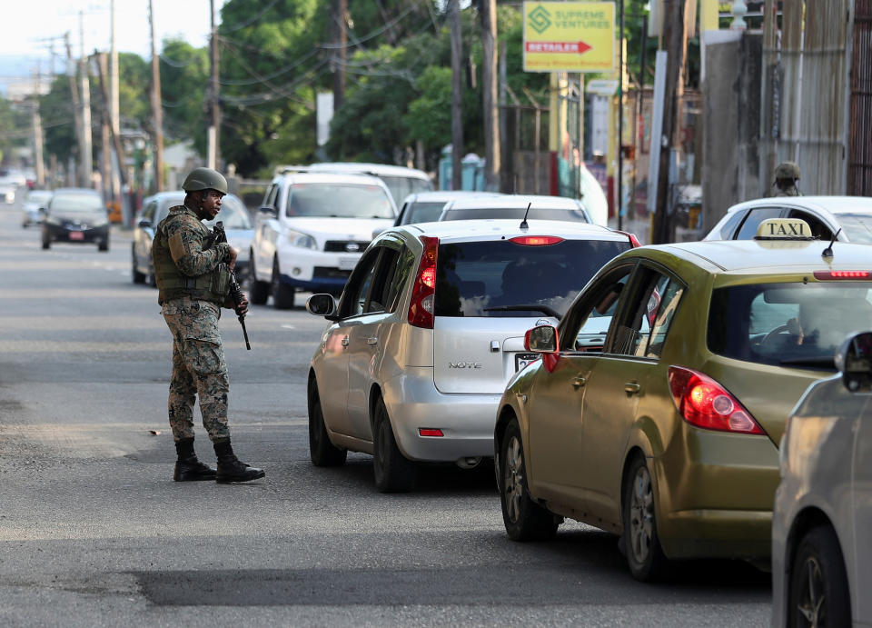 Members of security forces guard the streets as Jamaican Prime Minister Andrew Holness on Tuesday declared a state of public emergency in parts of the capital Kingston, and in some parishes in the central and western parts of the country, in a bid to control rising crime linked to gang violence, in Kingston, Jamaica November 15, 2022. REUTERS/Gilbert Bellamy