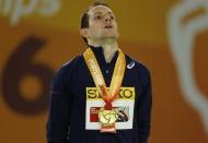 Renaud Lavillenie of France sings the French National Anthem during the medal ceremony after taking gold in the men's pole vault event at the IAAF World Indoor Athletics Championships in Portland, Oregon March 17, 2016. REUTERS/Mike Blake