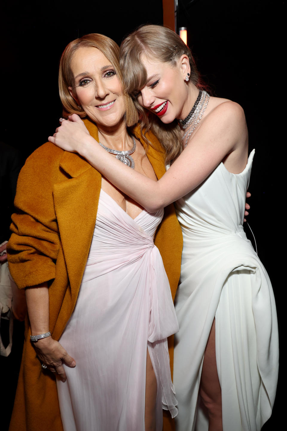 Celine Dion and Taylor Swift at the 66th GRAMMY Awards at Crypto.com Arena on Feb. 4, 2024, in Los Angeles. Dion presented the Album of the Year award, which Swift won for a record-breaking fourth time. / Credit: Kevin Mazur/Getty Images for The Recording Academy