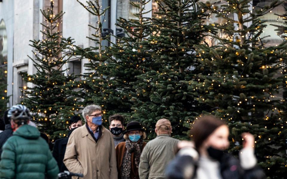  Shoppers wear protective masks as they walk past KaDeWe department store in Kurfurstendamm avenue on first shopping Sunday during the second wave of the coronavirus pandemic - Maja Hitij/Getty