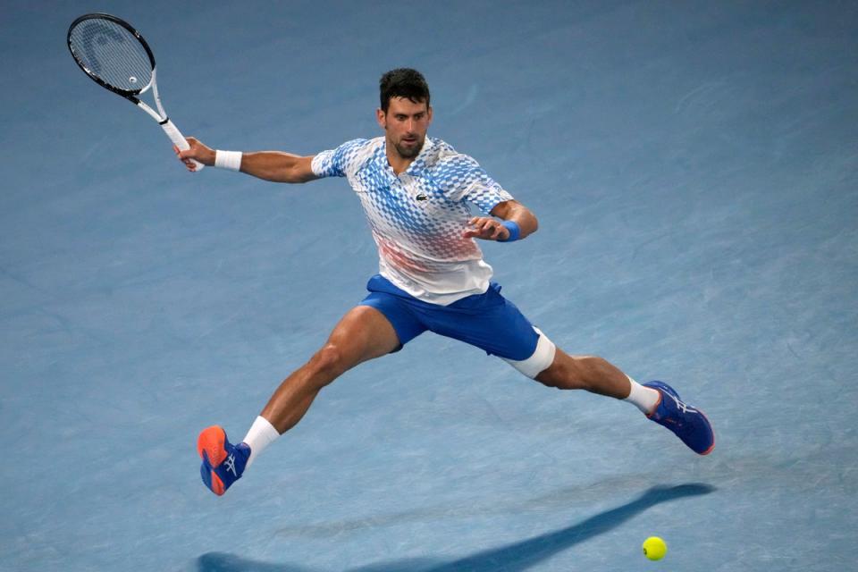 Novak Djokovic of Serbia plays a forehand return to Andrey Rublev of Russia (AP)