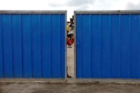 A worker closes the gate at Walini tunnel construction site for Jakarta-Bandung High Speed Railway in West Bandung regency, West Java province, Indonesia, February 21, 2019. REUTERS/Willy Kurniawan