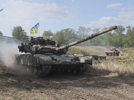 Ukrainian servicemen drive armoured vehicles during military exercises in the Donetsk region, Ukraine September 28, 2017. Picture taken September 28, 2017. REUTERS/Sergei Karazy