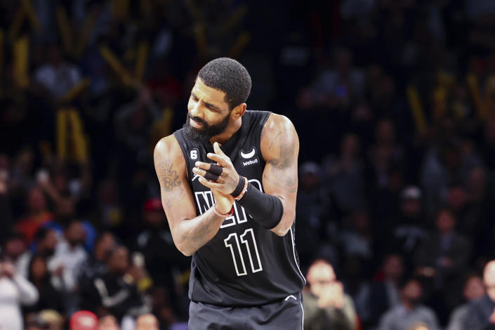 Brooklyn Nets guard Kyrie Irving (11) reacts after the team defeated the Indiana Pacers in an NBA basketball game Monday, Oct. 31, 2022, in New York. (AP Photo/Jessie Alcheh)