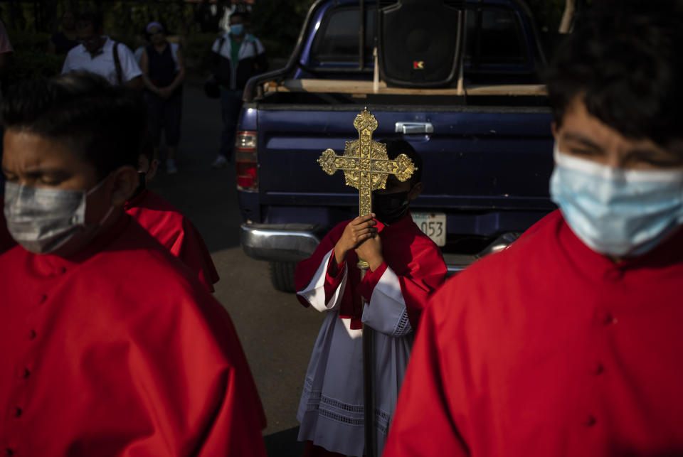 Catholics take part in a reenactment of the Stations of the Cross during the Lenten season at the Metropolitan Cathedral in Managua, Nicaragua, Friday, March 17, 2023. Amid tensions between the Vatican and the Daniel Ortega government, Catholics staged the devotional commemoration of Jesus Christ's last day on Earth in the gardens of the Cathedral due to the police ban on celebrating religious festivities on the streets. (AP Photo/Inti Ocon)