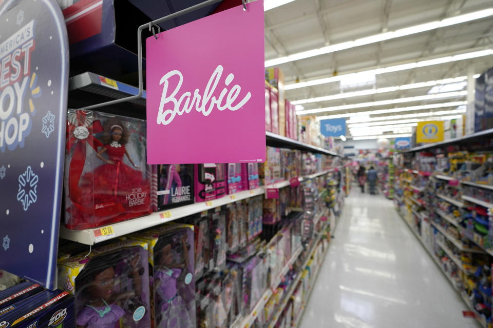 A Barbie sign hangs on an isle of toys at a Walmart Supercenter Friday, Nov. 9, 2018, in Houston. (AP Photo/David J. Phillip)