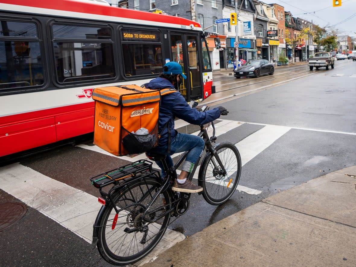 In a report released Tuesday, Toronto Community Bikeways Coalition (TCBC) found that despite city council's approved plan which calls for the installation of 100 kilometres of new protected bike lanes by the end of 2024 — an average of 33 kilometres per year — roughly 13.1 kilometres of bike lanes were opened in 2022.  (Carlos Osorio/CBC - image credit)
