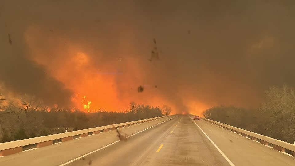 Greenville Fire-Rescue firefighters drive near the Smokehouse Creek Fire as it threatens the Texas towns of Canadian and Wheeler on Tuesday. - Greenville Fire-Rescue