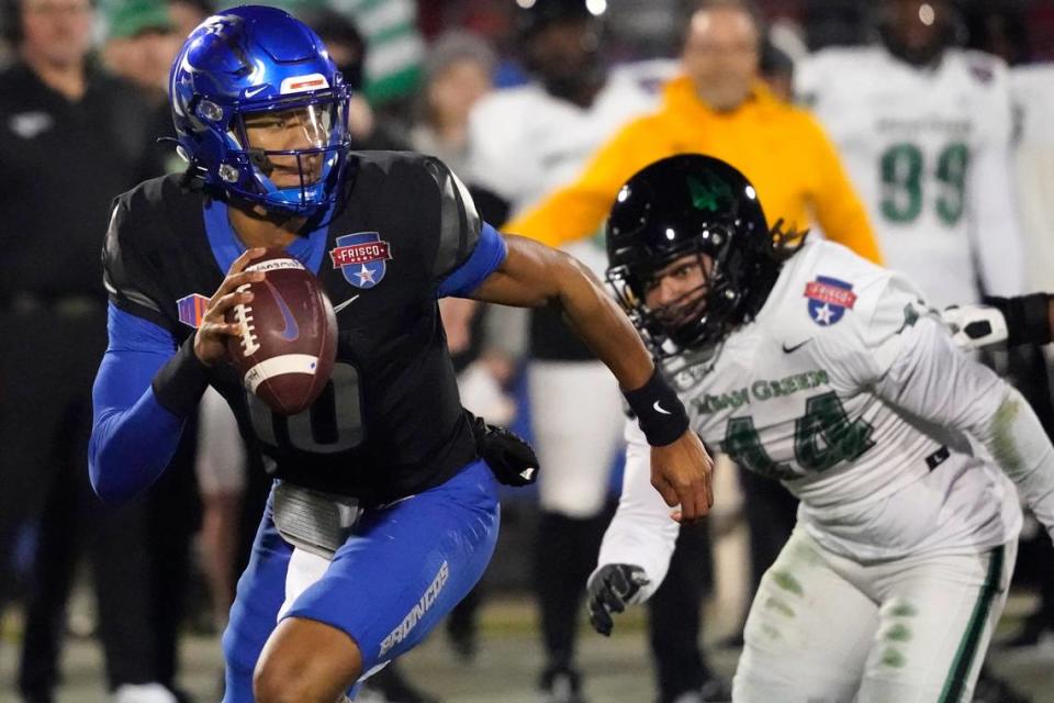Boise State quarterback Taylen Green (10) evades pressure in the first half of the Broncos’ 35-32 win over North Texas in the Frisco Bowl on Saturday. Green threw for 137 yards and a touchdown and added 119 yards and two touchdowns on the ground.